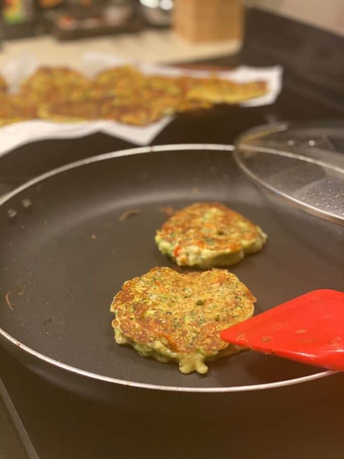 fritters cooking in large skillet