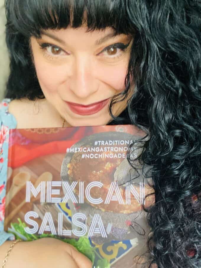 image of me holding my cookbook