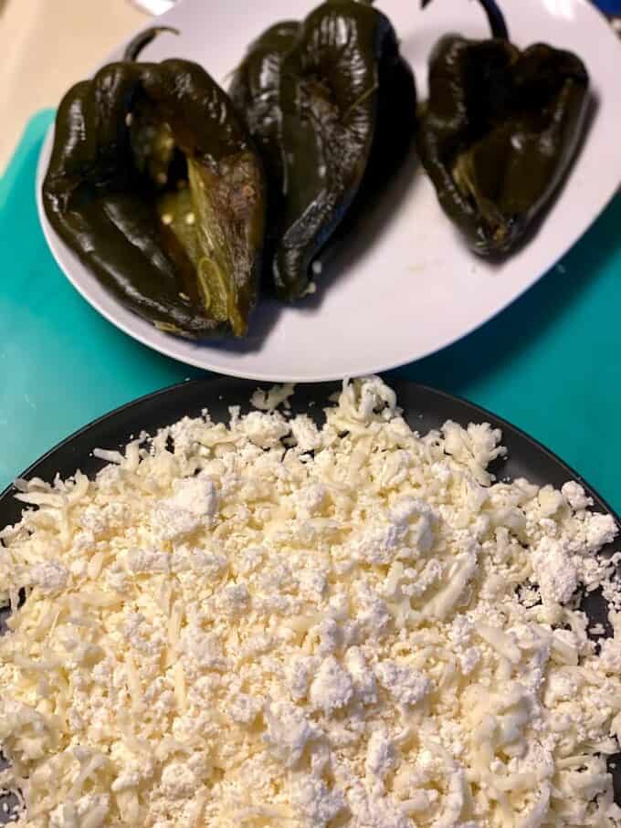 crumbled queso fresco with shreded melting cheese combined on plate