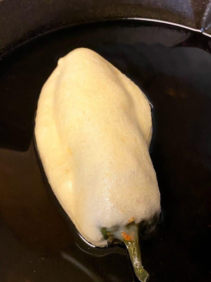 coated relleno in oil, cast iron skillet