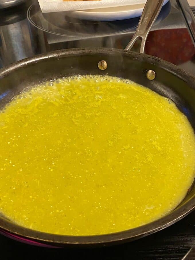salsa verde simmering in skillet