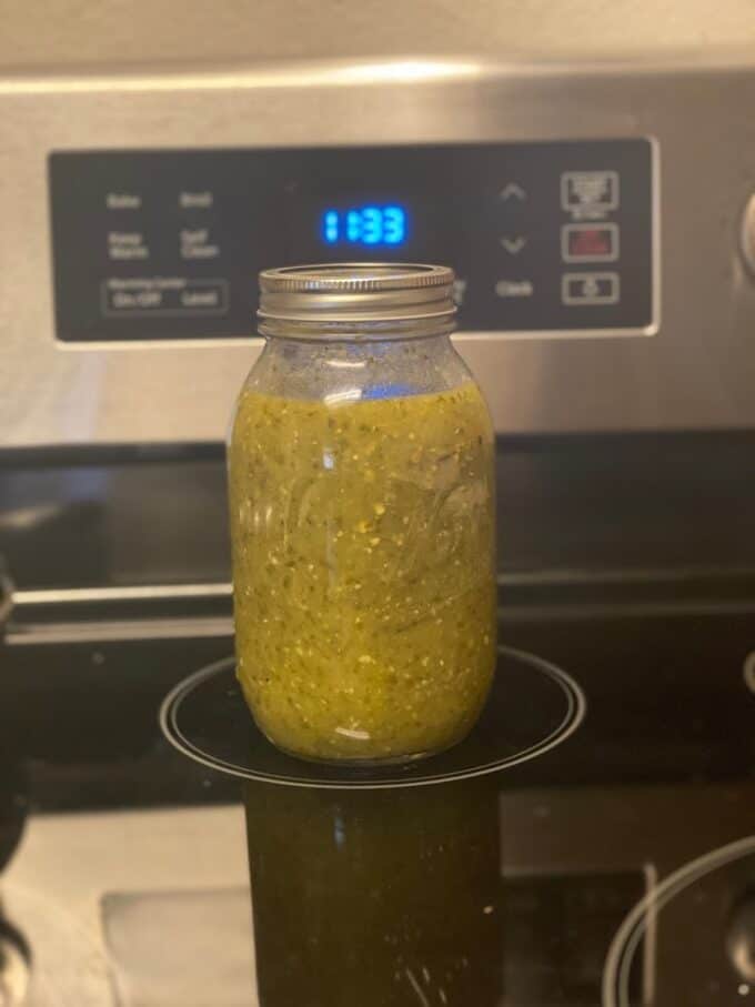 mason jar filed with homemade salsa verde
