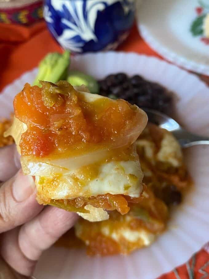 chile con queso on a piece of bread close up
