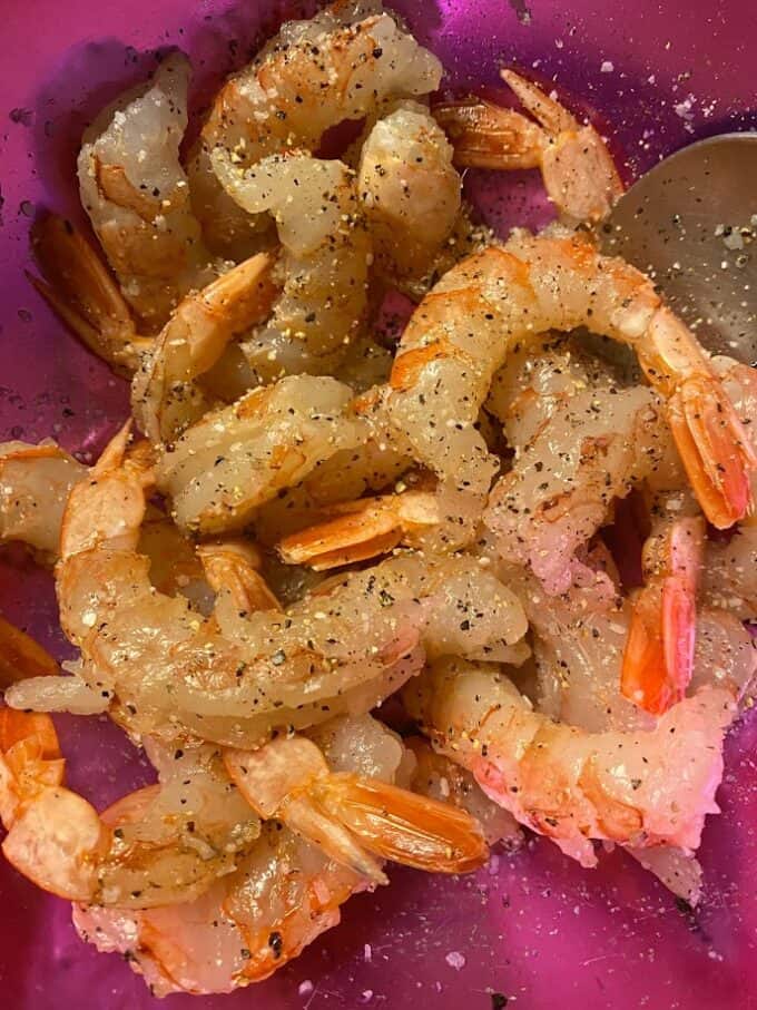 seasoned, uncooked shrimp in bowl