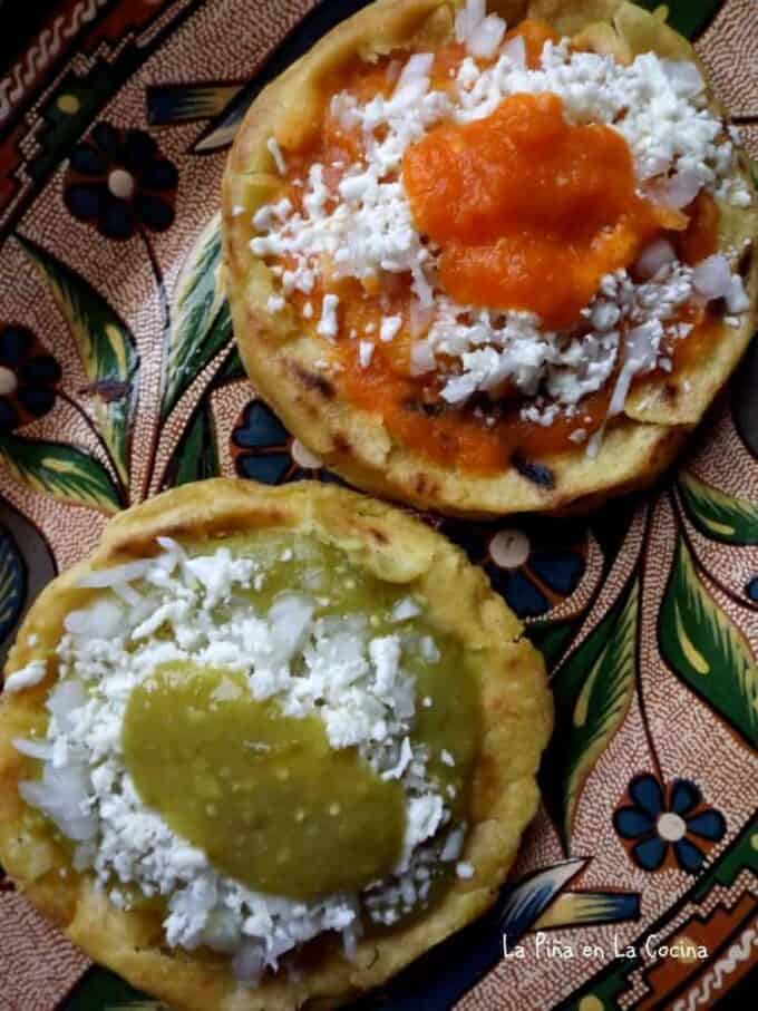 both red and green salsa on picaditas, sopes