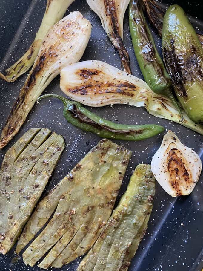 grilled spring onions, cactus and chile peppers
