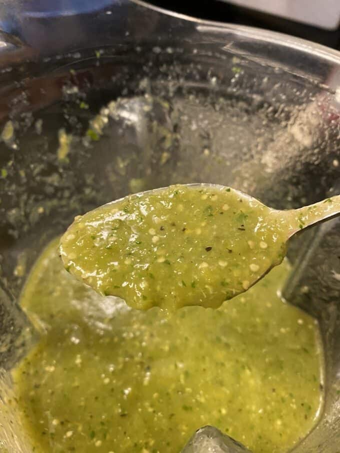 salsa verde on a spoon close up