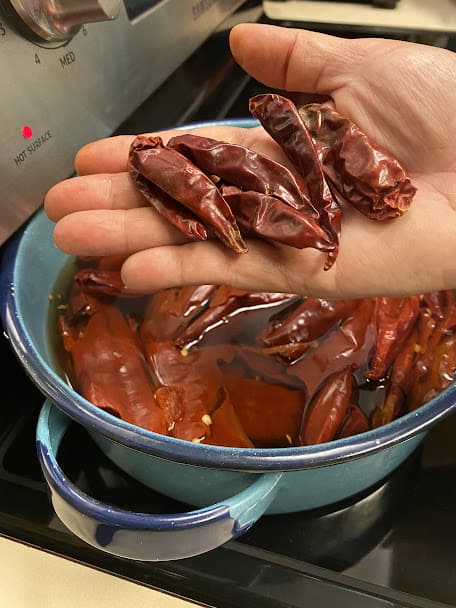 adding small chile japones pods to add some heat to the sauce