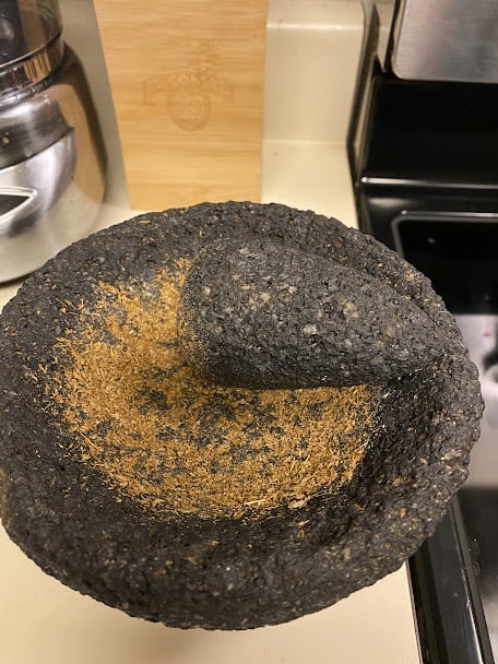 cumin seeds crushed in a mexican molcajete