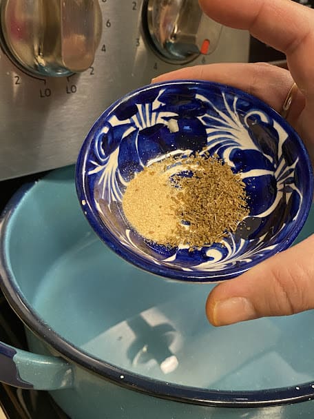 fresh ground cumin seeds and granulated garlic in small bowl