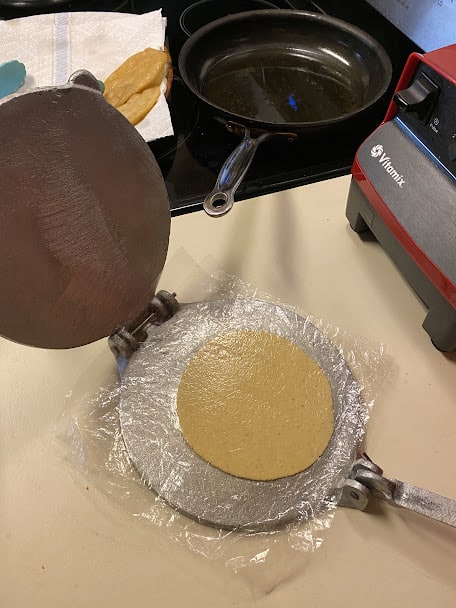using tortilla press to press small corn tortillas
