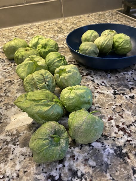 fresh tomatillos on the counter