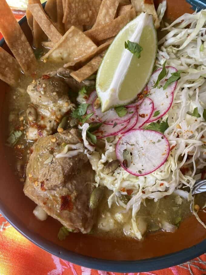 close up of green chile pozole in the bowl