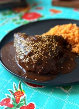 chicken mole plated with rice
