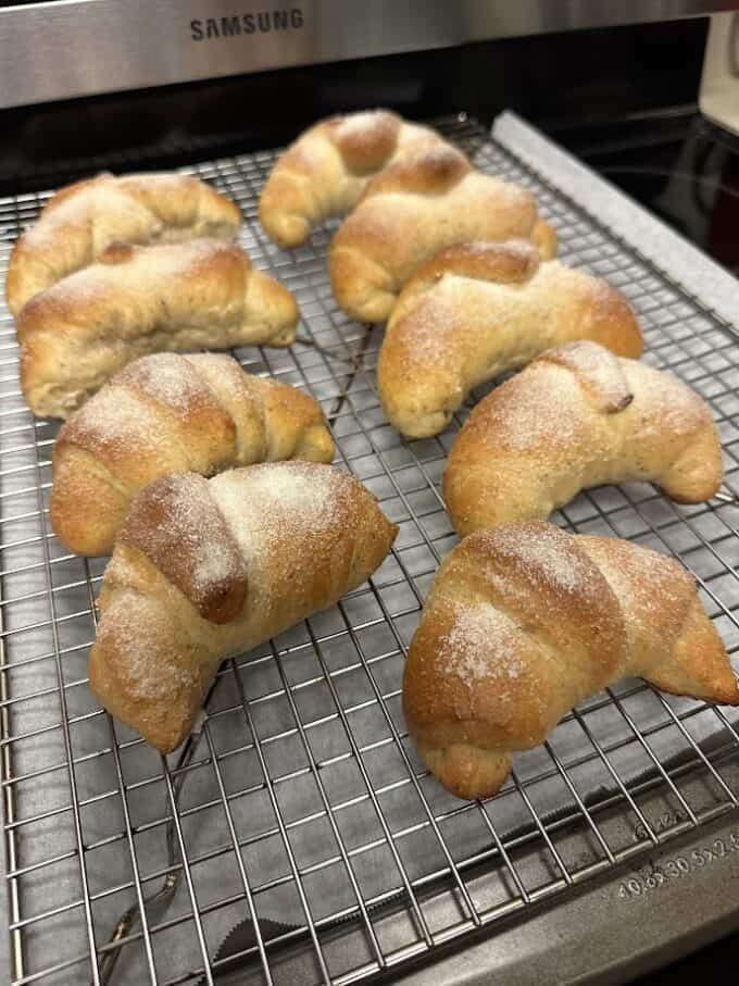 fresh sweet bread cooling on metal rack