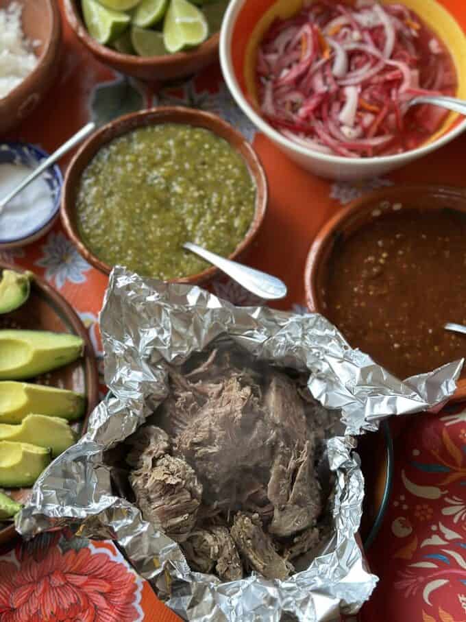 lamb barbacoa with all the garnishes