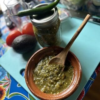 Serrano hot sauce in mason jar and small bowl