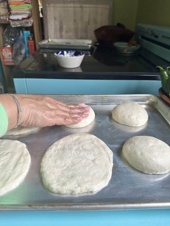 flattening dough balls