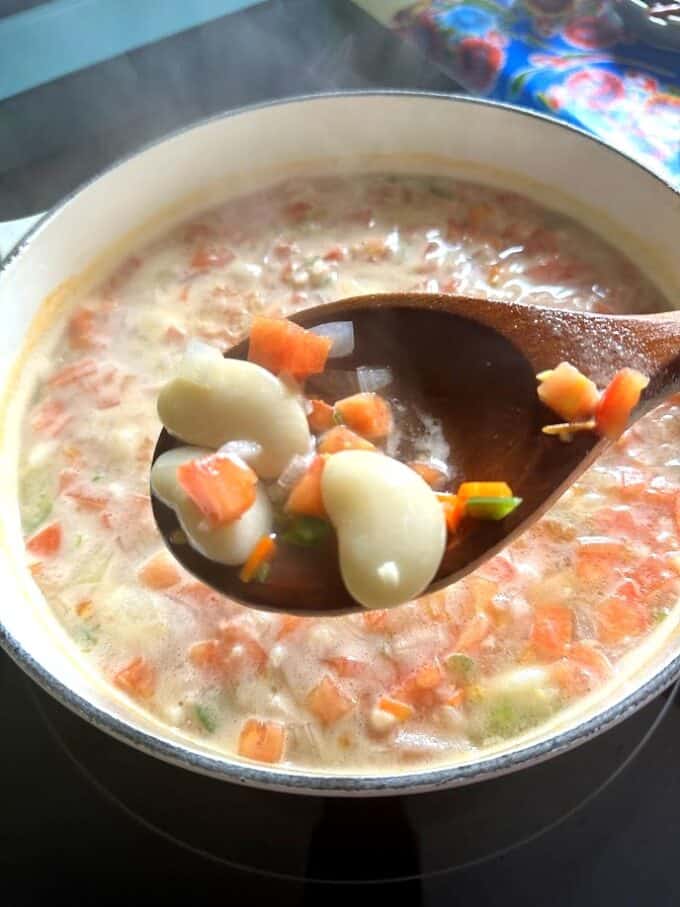 fava bean soup on wooden spoon