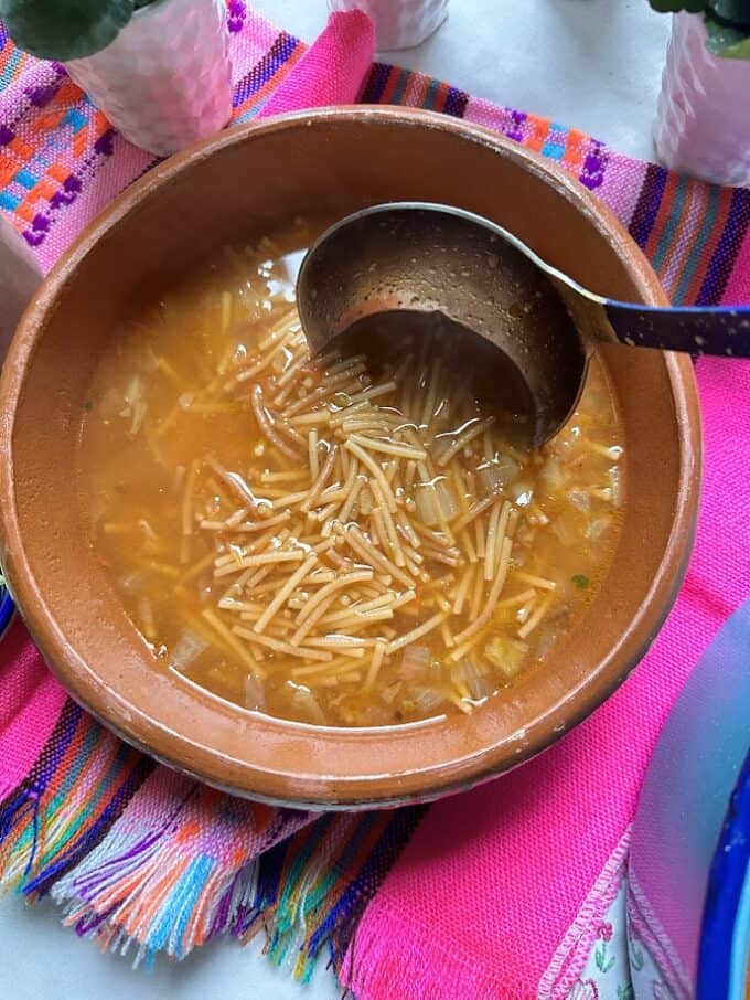 fideo plated in large bowl with ladle