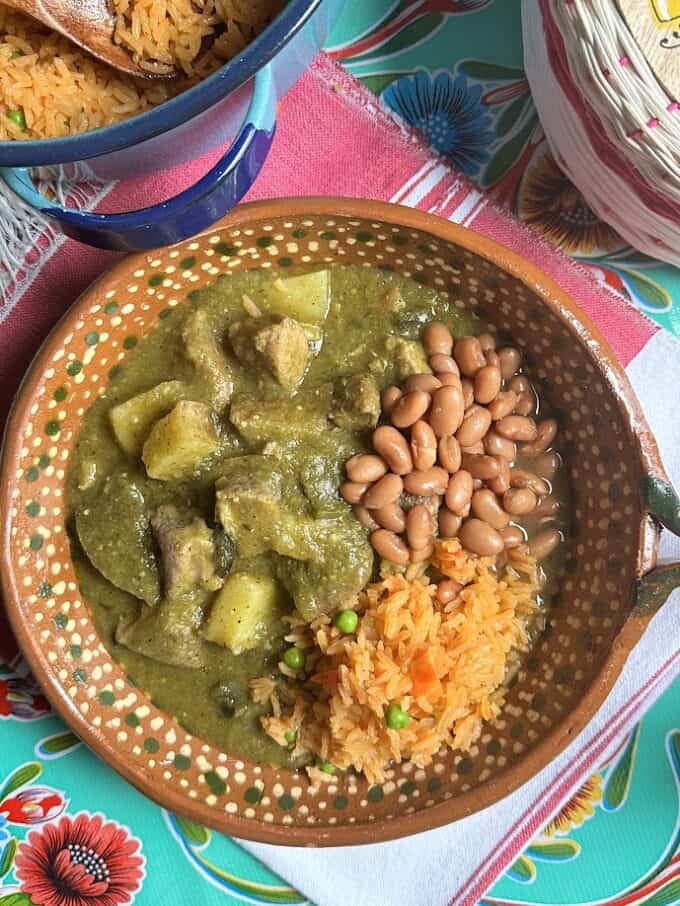 top view of chile verde with potatoes, served with rice and beans