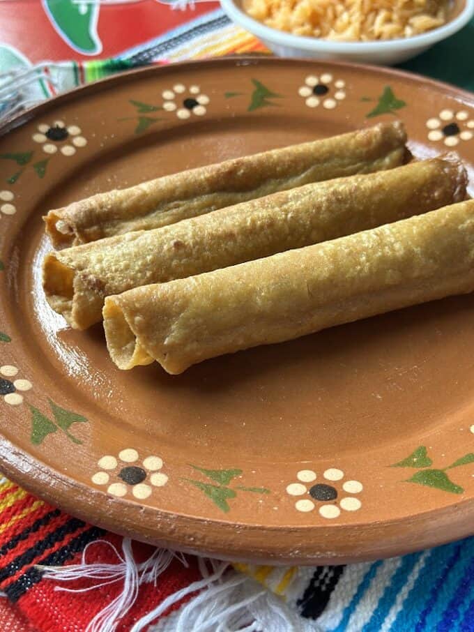 beef taquitos on a plate without garnish