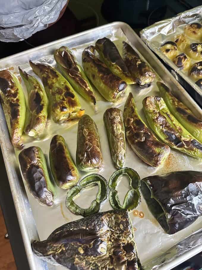 roasted green chiles on baking sheet