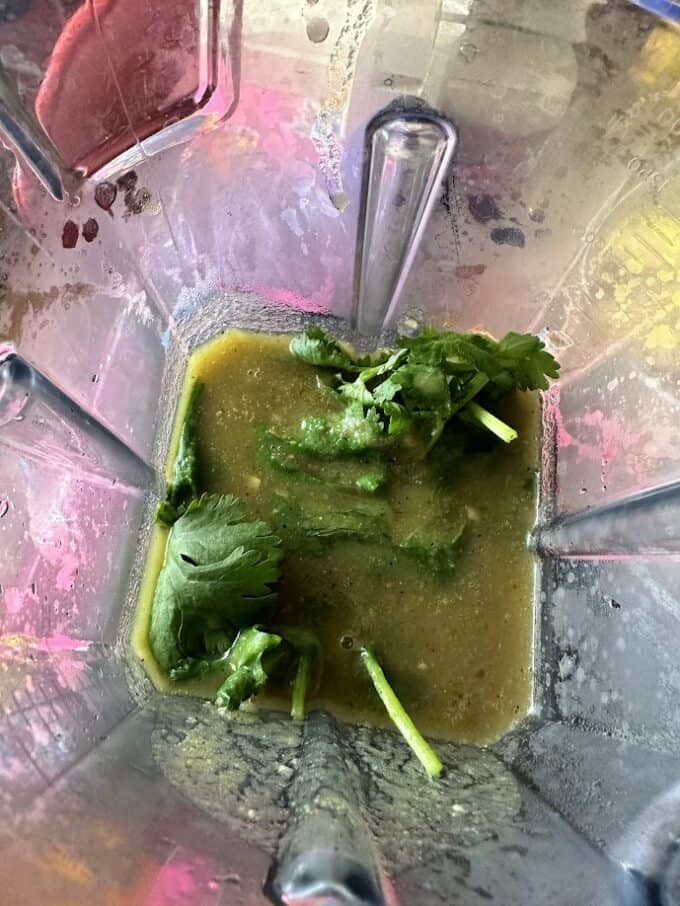 blending some cilantro into the sauce