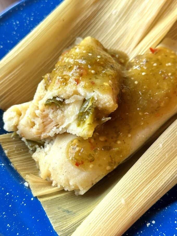 cut open tamal stacked on a plate