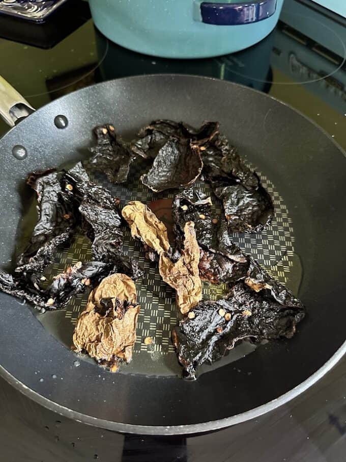 frying dried chiles in skillet