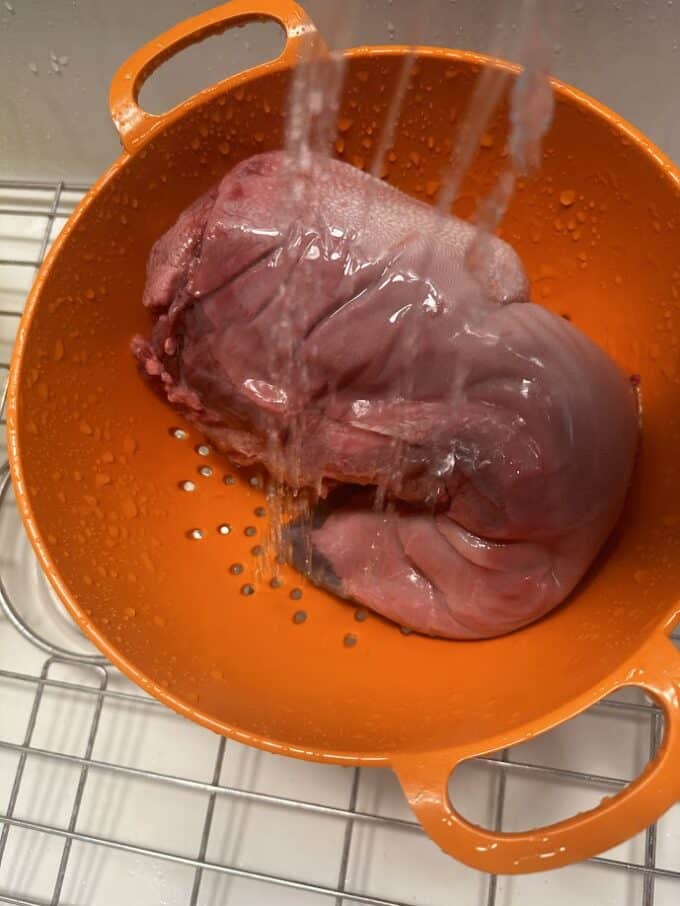 rinsing beef tongue in colander