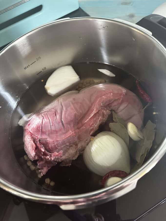 beef tongue with aromatics in pressure cooker