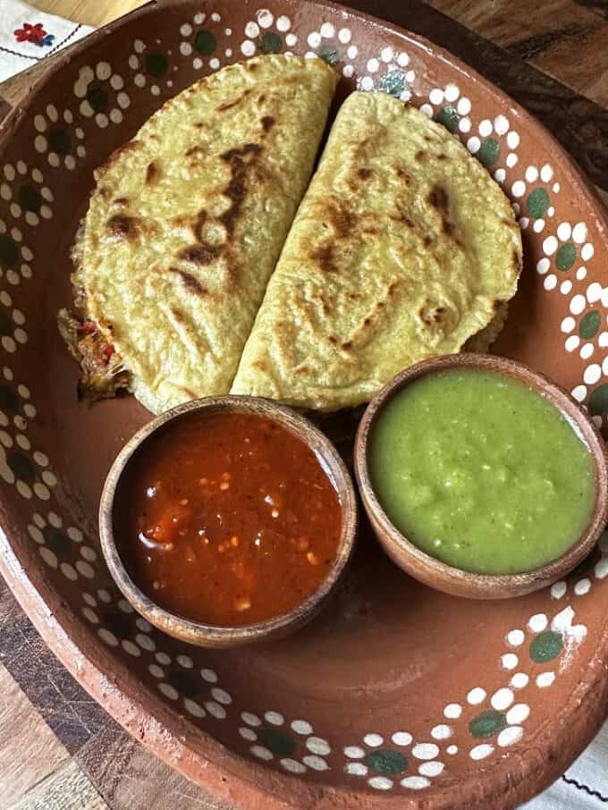 quesadillas with red salsa and green salsa