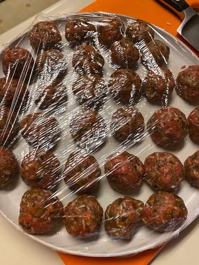 meatballs on plate covered with plastic wrap