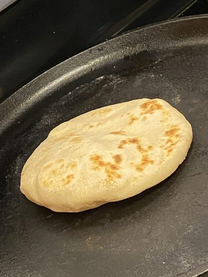 gordita cooking on cast iron griddle