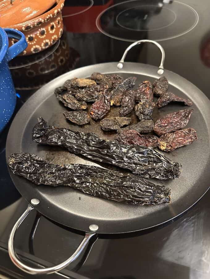 toasting dried chiles on comal