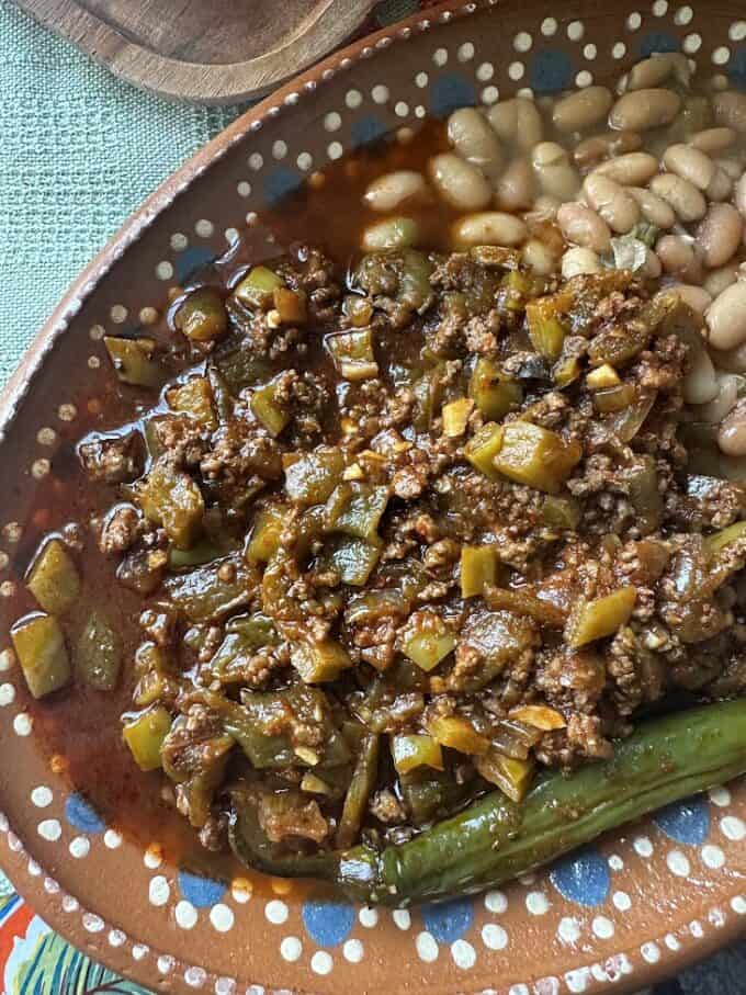 beef with cactus and green chile plated close up