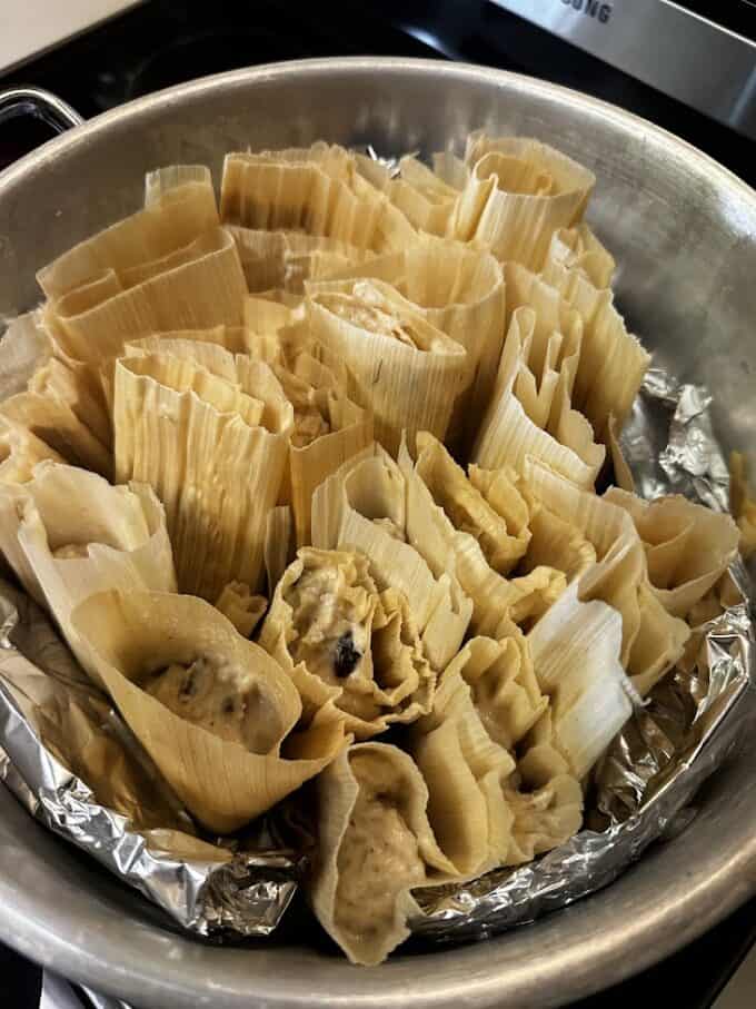 uncooked tamales in steamer pot