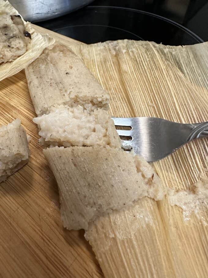 tamal sliced open to expose inside