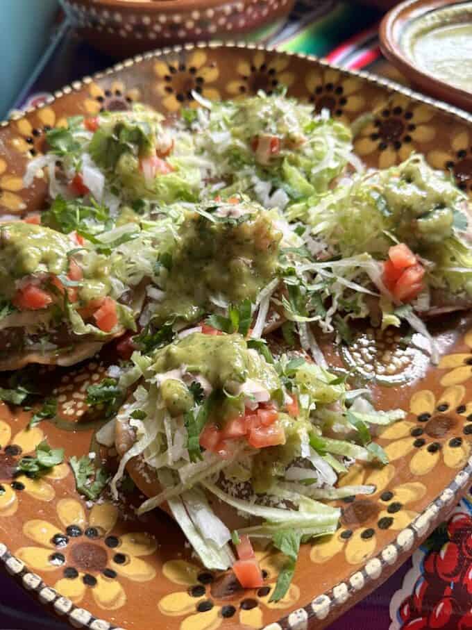 layered tostadas with salsa cremosa on top