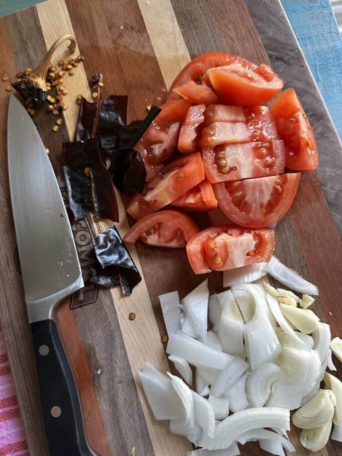 chopped tomatoes, onion, garlic and torn chile guajillo