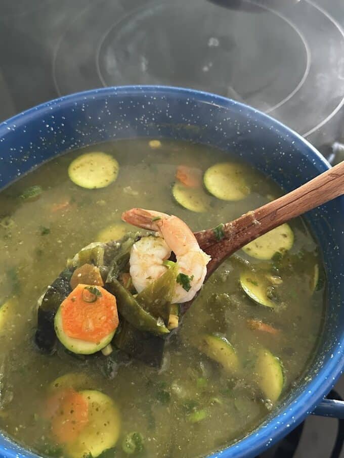 shrimp soup in ladle up close