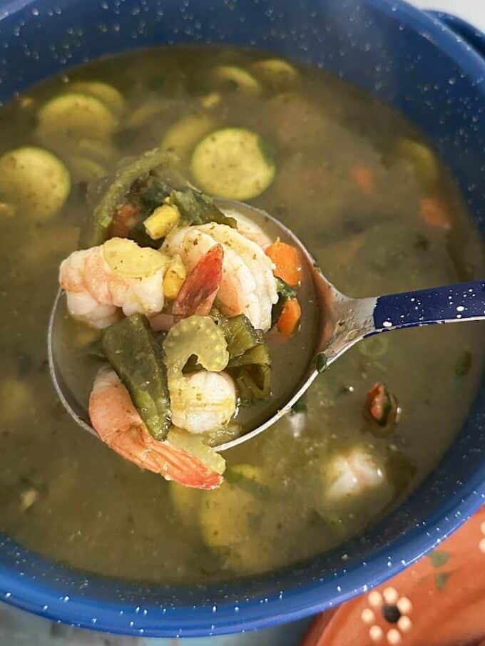shrimp soup up close in ladle
