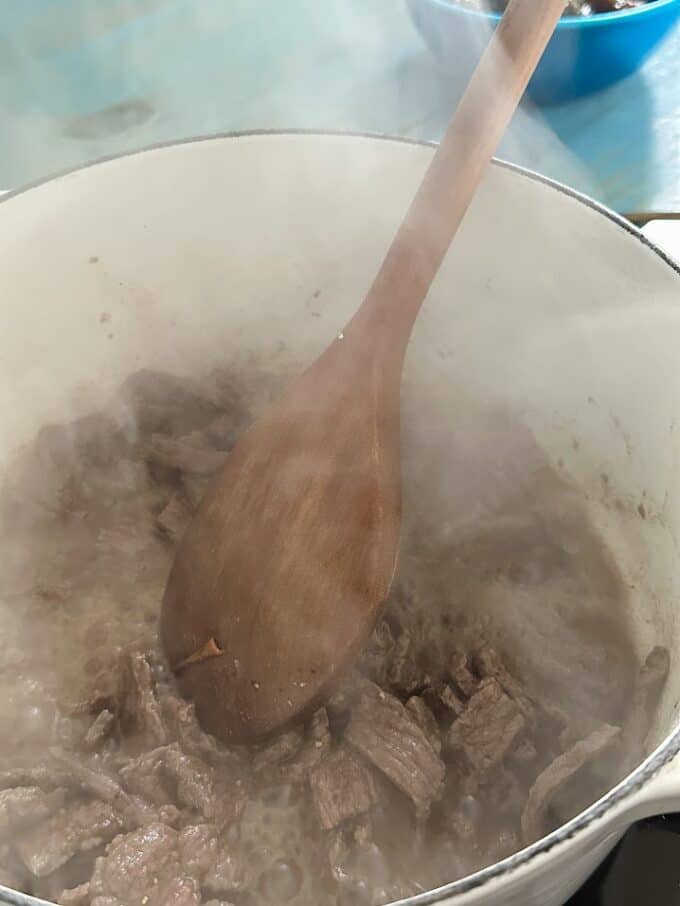 browning the seasoned beef in large pot
