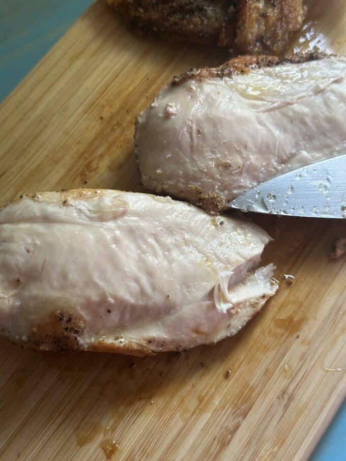 cooked chicken breast after removing the skins