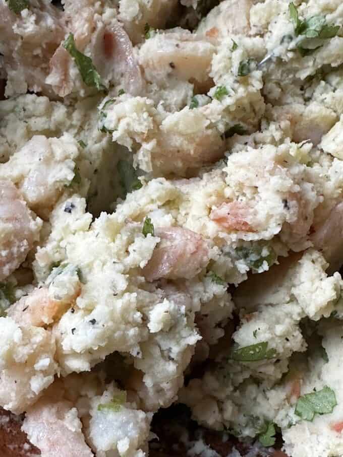 mashed potatoes mixed with shrimp and cilantro