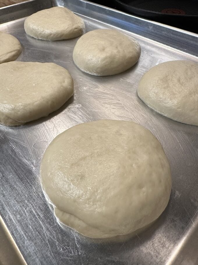 unbaked rolls on sheet pan