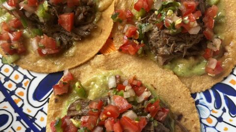 three beef tacos plated