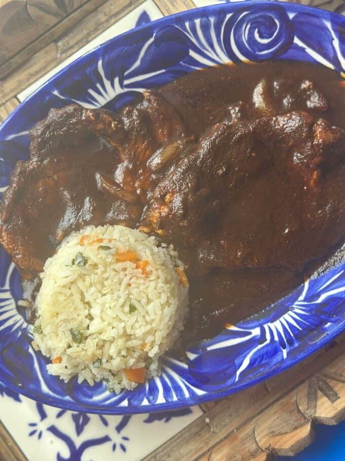 pork chops in salsa with rice on the side